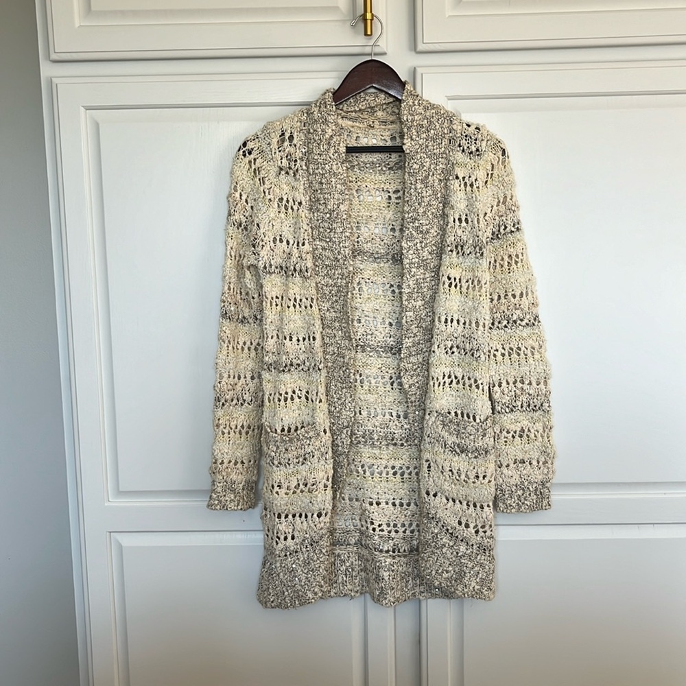 Elegant cardigan with open weave and a little sparkle.
